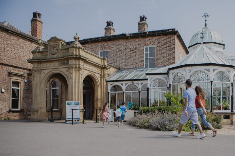 Preston Park Museum exterior with family