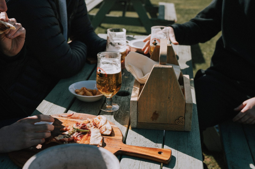 Pizza on a wood board at The Raby Arms in Hart Village