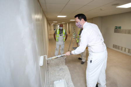 Mayor Houchen helping out with the painting work